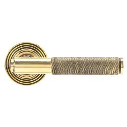 From The Anvil Aged Brass Knurled Door Handles on Round Beehive Rose - Brompton Range