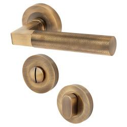Hampstead Antique Solid Brass Knurled Door Handles on Rose with Turn & Release