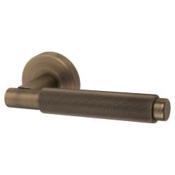 Jigtech Matt Antique Brass Knurled Door Handles on Round Rose - Textura Range