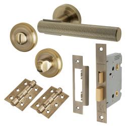 Altro Antique Brass Knurled Bathroom Lock Door Handles on Rose Pack - Orla Range