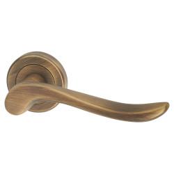 Serozzetta by Carlisle Brass Antique Brass Scroll Door Handles on Round Rose - Verdun Range