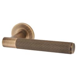 Alexander and Wilks Antique Brass Knurled Door Handles on Round Rose - Spitfire Range