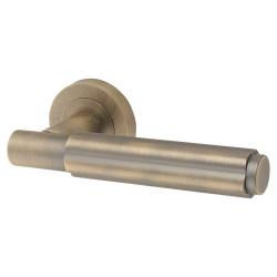 Jedo Antique Brass Fire Rated Fluted Door Handles on Round Rose - Bloom Range
