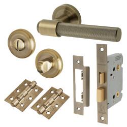 Altro Antique Brass Knurled Bathroom Lock Door Handles on Rose Pack - Esme Range
